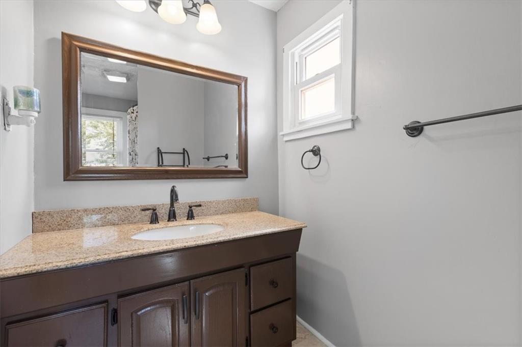 450 Irvin Avenue Rochester, PA 15074 - Photo 25 of 30 a bathroom with a sink vanity and a mirror