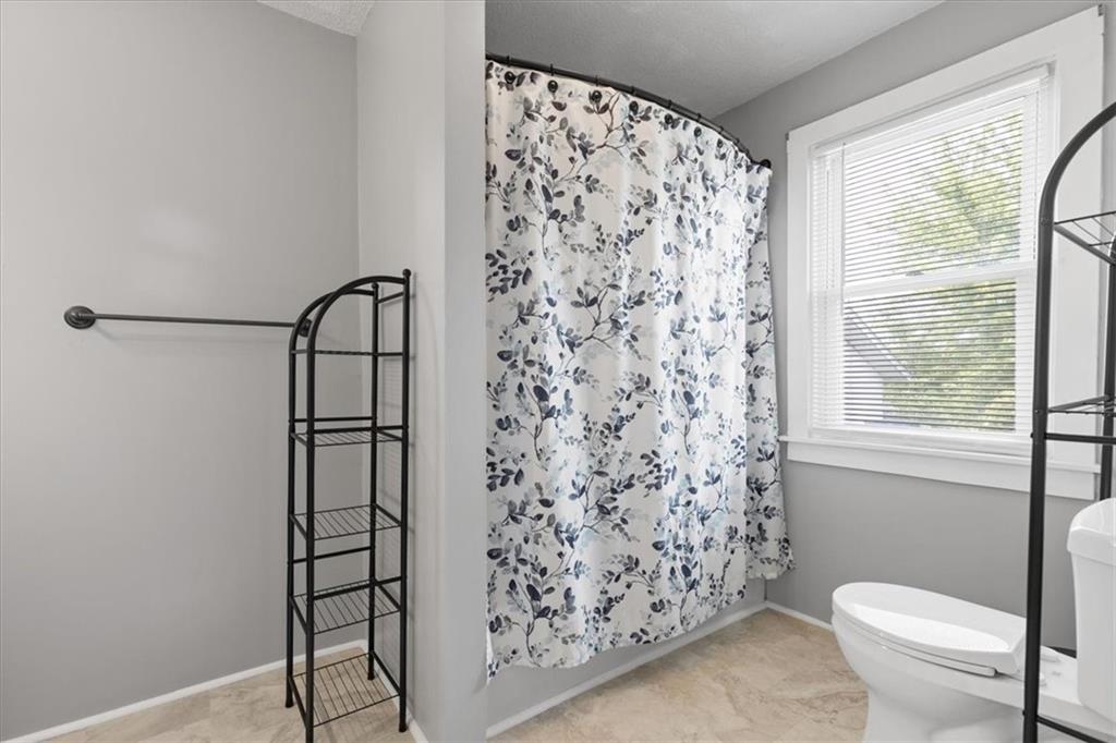 450 Irvin Avenue Rochester, PA 15074 - Photo 26 of 30 a bathroom with a toilet and a shower curtain