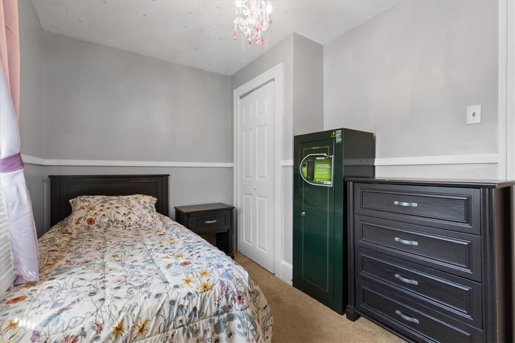 450 Irvin Avenue Rochester, PA 15074 - Photo 27 of 30 a bedroom with a bed and a mirror