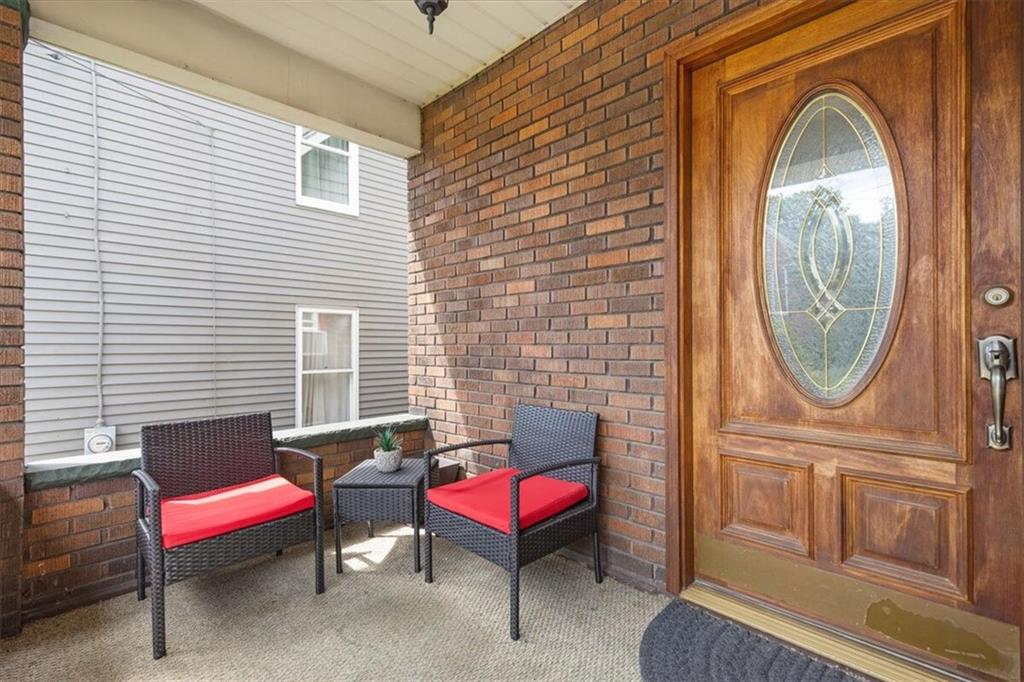 450 Irvin Avenue Rochester, PA 15074 - Photo 4 of 30 a outdoor living space with furniture a rug and a window