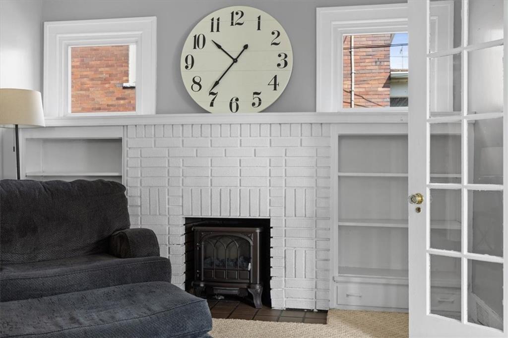 450 Irvin Avenue Rochester, PA 15074 - Photo 7 of 30 a living room with a couch a window and a fireplace