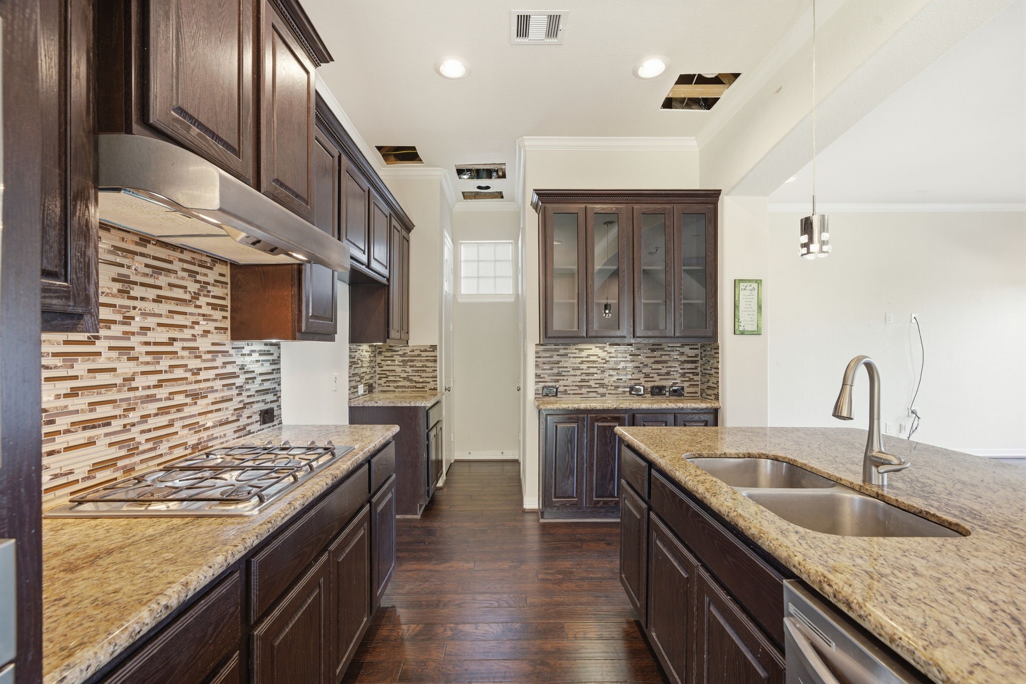 10218 Spring Shadows Park Circle Houston, TX 77080 - Photo 16 of 46 a kitchen with stainless steel appliances granite countertop a sink stove and oven