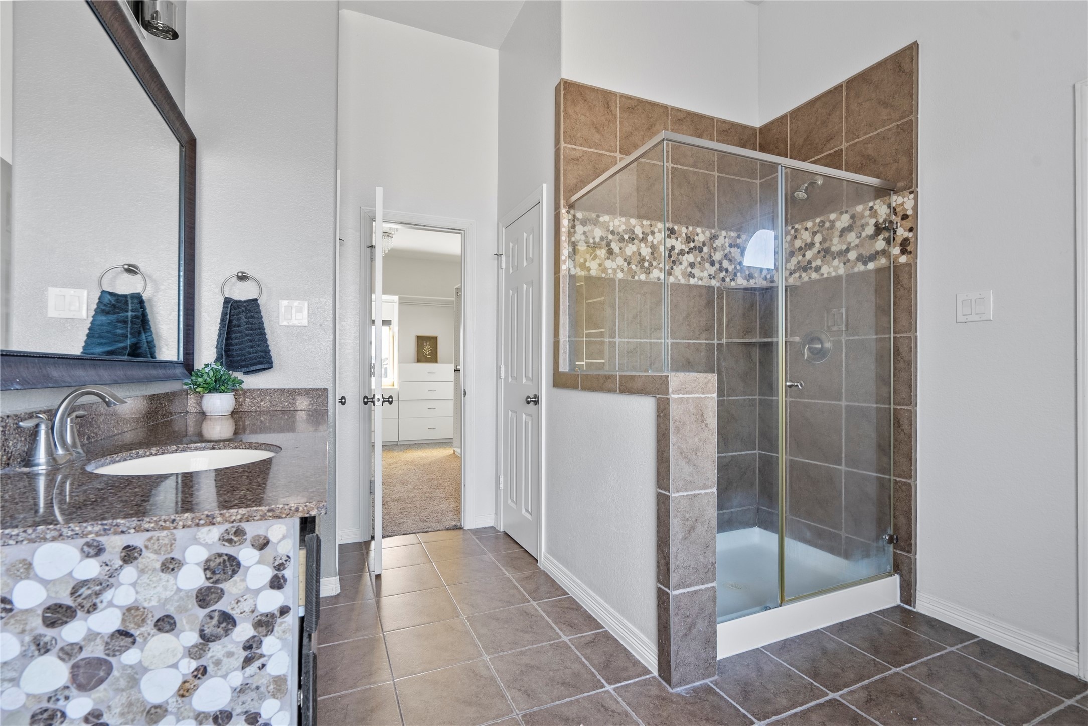 10218 Spring Shadows Park Circle Houston, TX 77080 - Photo 30 of 46 a bathroom with a shower and a sink