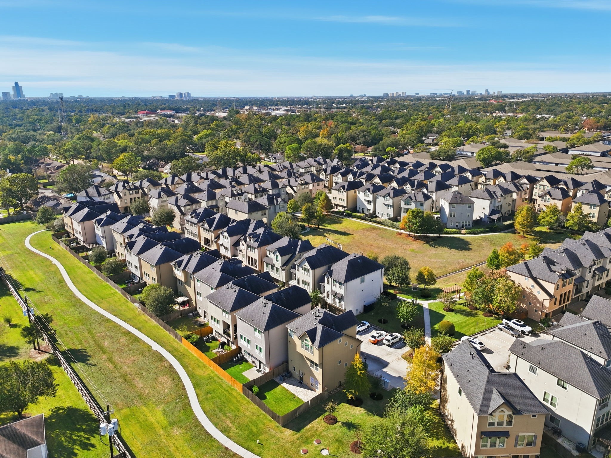 10218 Spring Shadows Park Circle Houston, TX 77080 - Photo 5 of 46 an aerial view of residential building and lake
