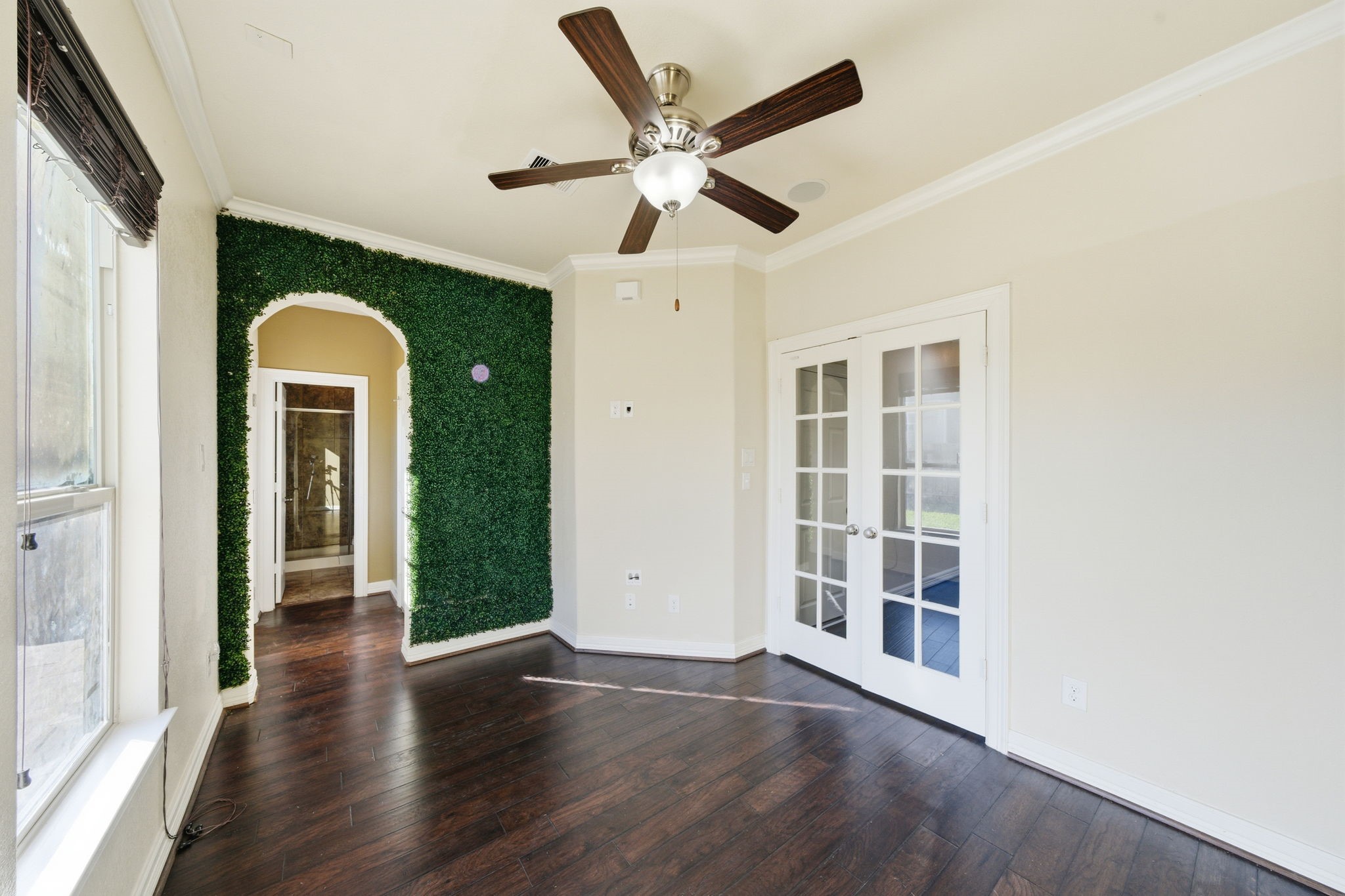 10218 Spring Shadows Park Circle Houston, TX 77080 - Photo 10 of 46 wooden floor in an empty room with a window