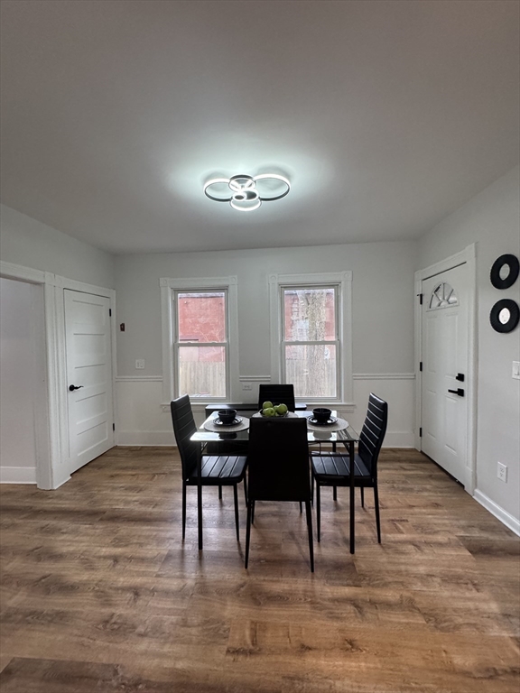 48 Santa Barbara Street Springfield, MA 01104 - Photo 12 of 33 a view of a dining room with furniture and wooden floor