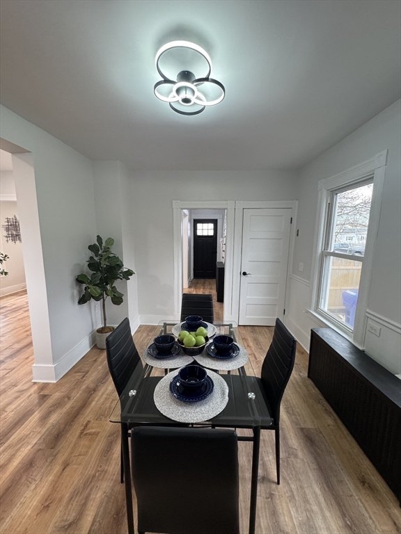 48 Santa Barbara Street Springfield, MA 01104 - Photo 13 of 33 a view of a dining room with furniture and wooden floor