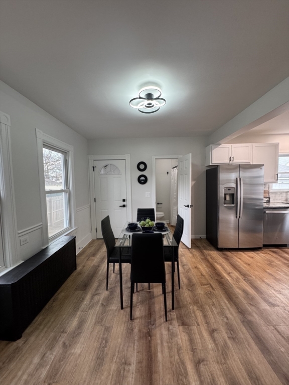 48 Santa Barbara Street Springfield, MA 01104 - Photo 14 of 33 a view of a dining room with furniture and wooden floor