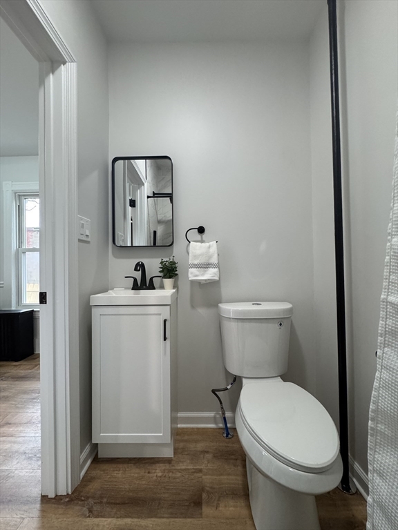 48 Santa Barbara Street Springfield, MA 01104 - Photo 17 of 33 a white toilet sitting next to a bathroom sink