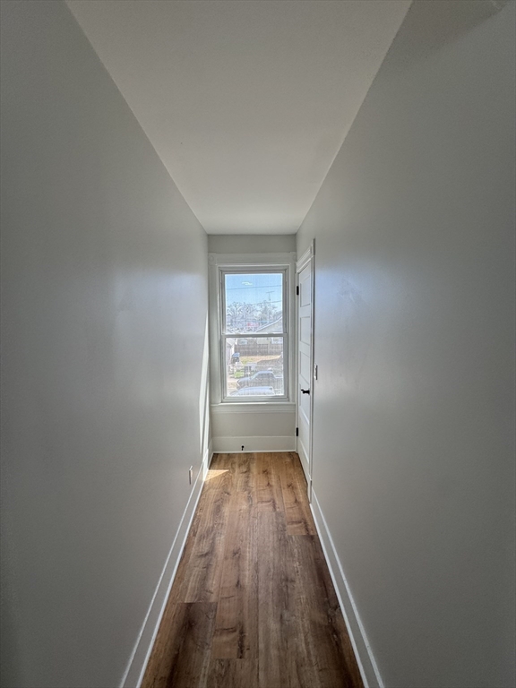 48 Santa Barbara Street Springfield, MA 01104 - Photo 20 of 33 a view of a hallway with wooden floor