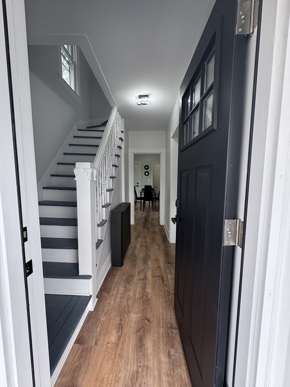 48 Santa Barbara Street Springfield, MA 01104 - Photo 2 of 33 a view of a hallway with wooden floor and stairs