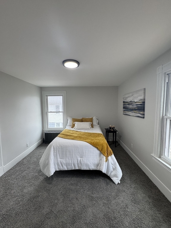 48 Santa Barbara Street Springfield, MA 01104 - Photo 23 of 33 a bedroom with a bed and a window