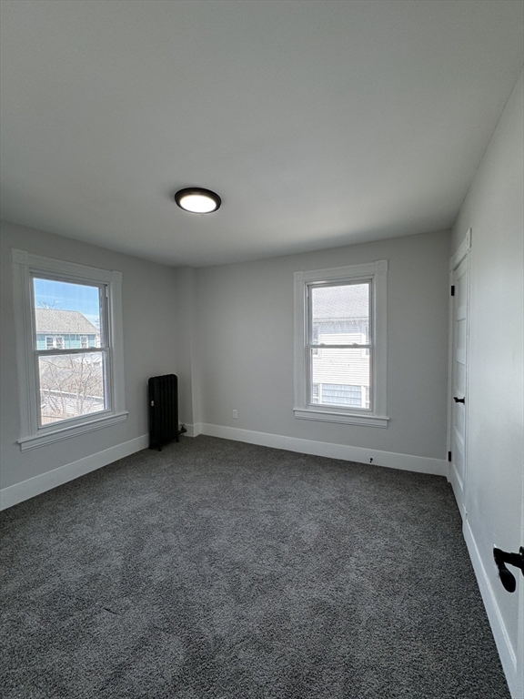 48 Santa Barbara Street Springfield, MA 01104 - Photo 26 of 33 an empty room with windows
