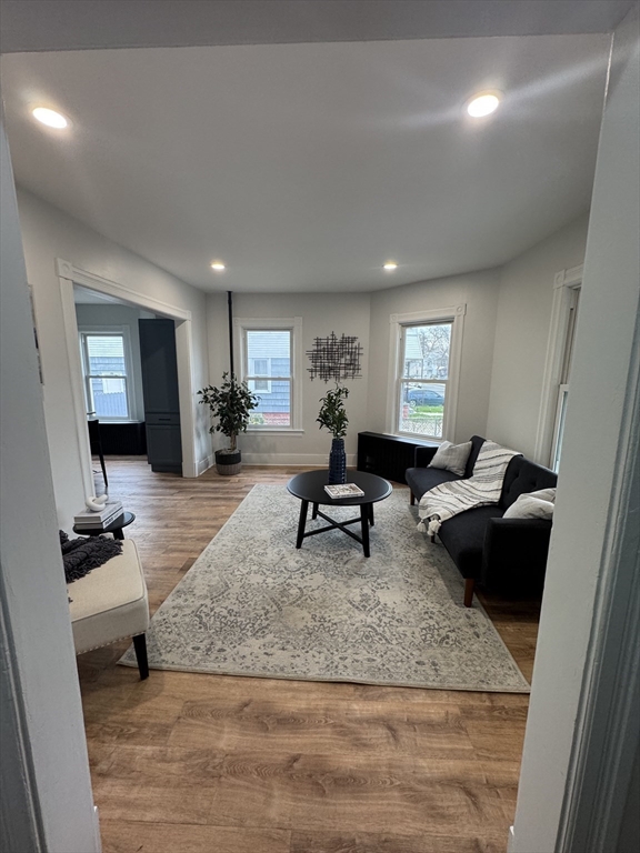 48 Santa Barbara Street Springfield, MA 01104 - Photo 3 of 33 a living room with furniture and a rug