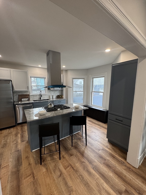 48 Santa Barbara Street Springfield, MA 01104 - Photo 8 of 33 a living room with stainless steel appliances furniture a rug and a table