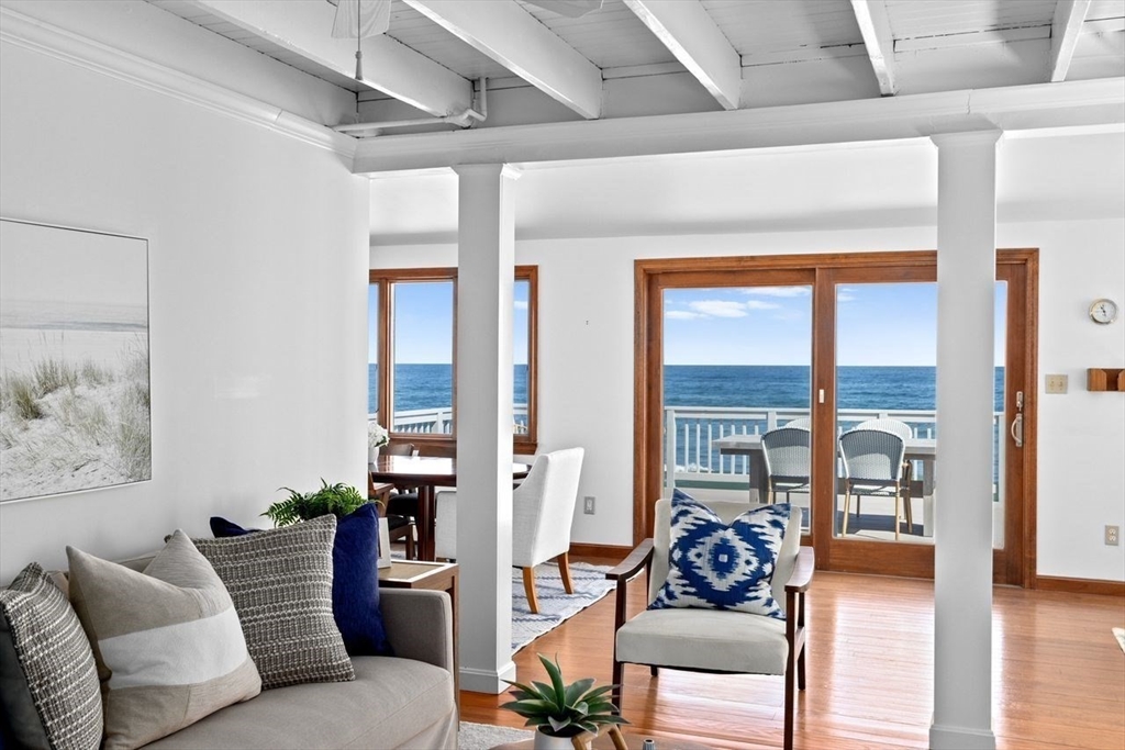 75 Rebecca Road Scituate, MA 02066 - Photo 13 of 42 a living room with furniture and floor to ceiling windows