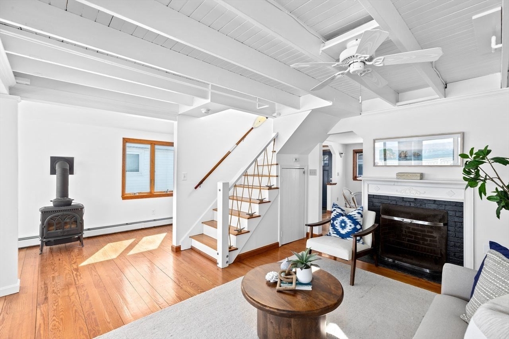 75 Rebecca Road Scituate, MA 02066 - Photo 17 of 42 a living room with furniture and a fireplace
