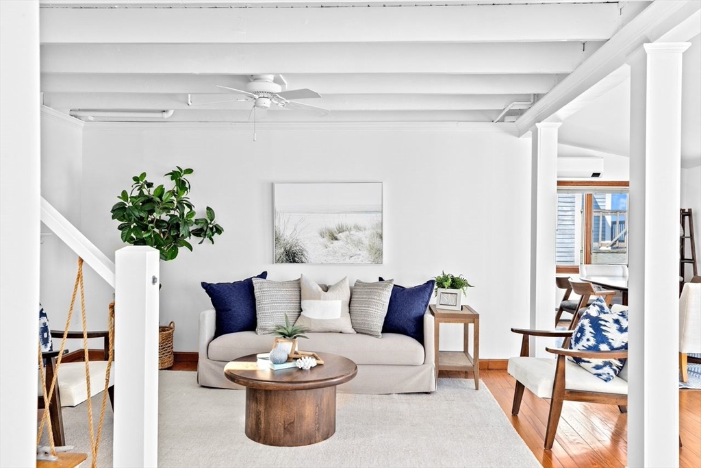 75 Rebecca Road Scituate, MA 02066 - Photo 19 of 42 a living room with furniture and a potted plant