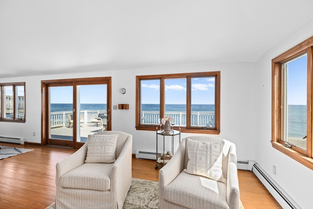 75 Rebecca Road Scituate, MA 02066 - Photo 21 of 42 a living room with furniture and floor to ceiling windows