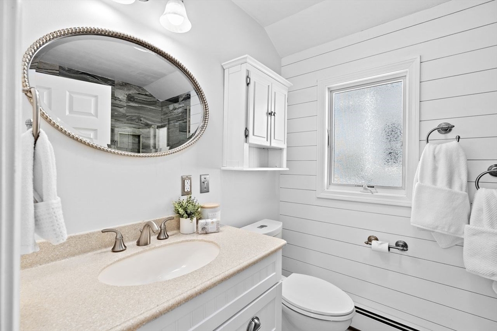 75 Rebecca Road Scituate, MA 02066 - Photo 28 of 42 a bathroom with a sink a toilet and a mirror