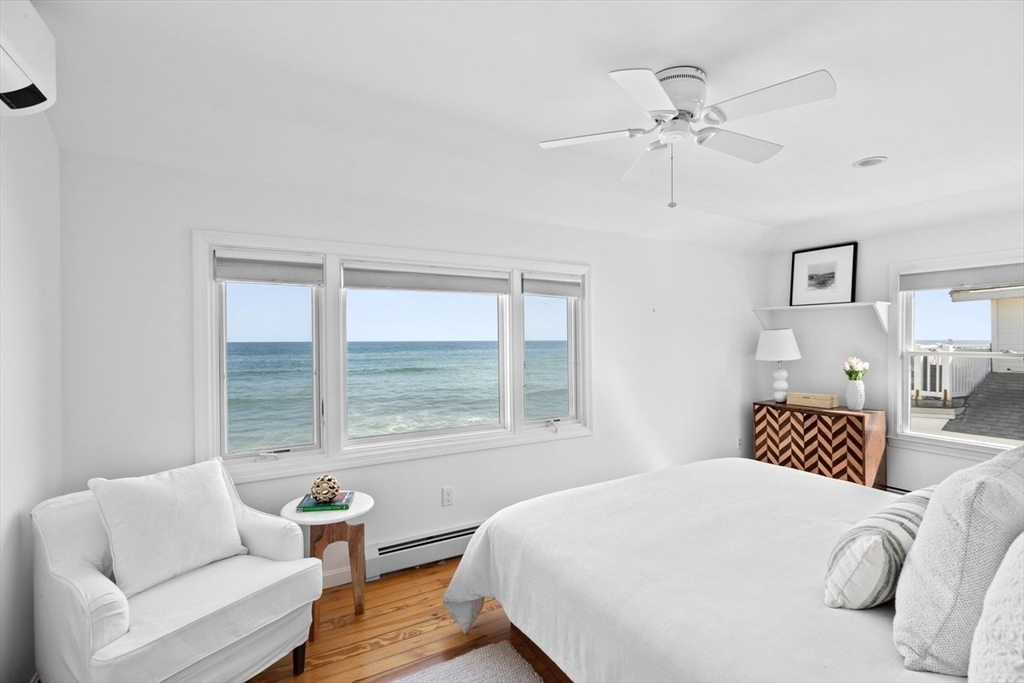75 Rebecca Road Scituate, MA 02066 - Photo 30 of 42 a bedroom with a bed and wooden floor