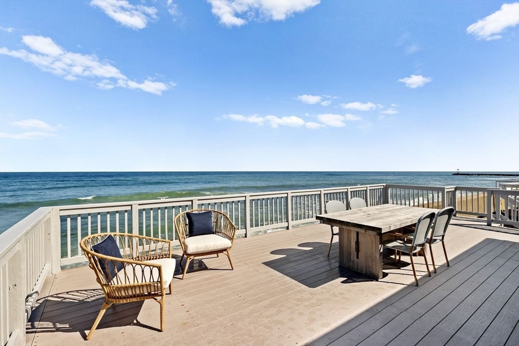 75 Rebecca Road Scituate, MA 02066 - Photo 34 of 42 a view of a roof deck with dining table and chairs with wooden floor