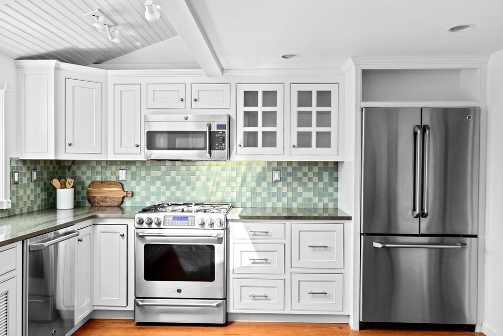 75 Rebecca Road Scituate, MA 02066 - Photo 7 of 42 a kitchen with stainless steel appliances white cabinets and a refrigerator