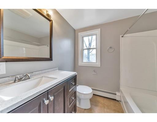 37 Sunrise Terrace Springfield, MA 01119 - Photo 9 of 27 a bathroom with a granite countertop sink a toilet and a mirror