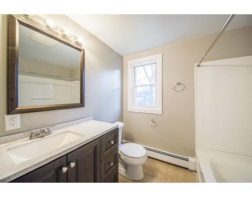 37 Sunrise Terrace Springfield, MA 01119 - Photo 10 of 27 a bathroom with a sink a toilet and mirror