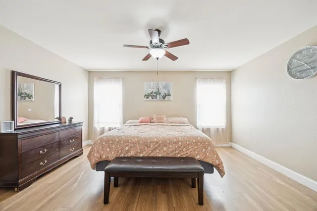 a bedroom with a bed and a dresser