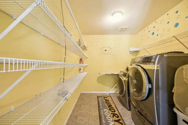 a view of a balcony with washer and dryer