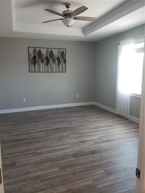 9013 Southwest 79th Lane Ocala, FL 34481 - Photo 13 of 21 wooden floor in an empty room