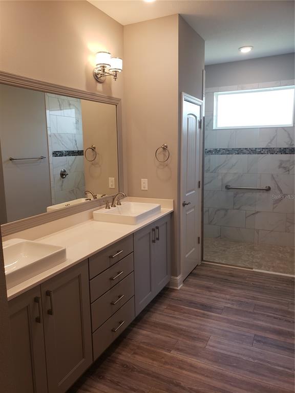 9013 Southwest 79th Lane Ocala, FL 34481 - Photo 15 of 21 a bathroom with double vanity sink and a mirror
