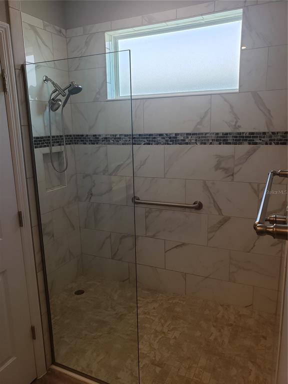 9013 Southwest 79th Lane Ocala, FL 34481 - Photo 16 of 21 a bathroom with a shower
