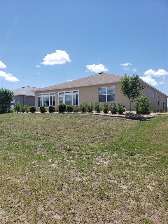 9013 Southwest 79th Lane Ocala, FL 34481 - Photo 21 of 21 a big room with yard and trees