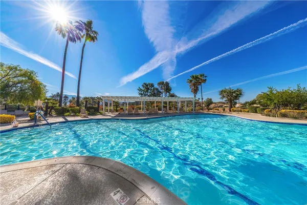 a view of a garden with a house