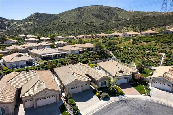 an aerial view of a backyard with garden