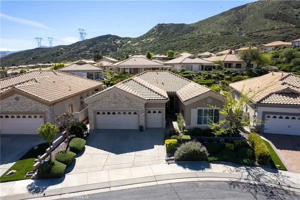a view of multiple houses with a street