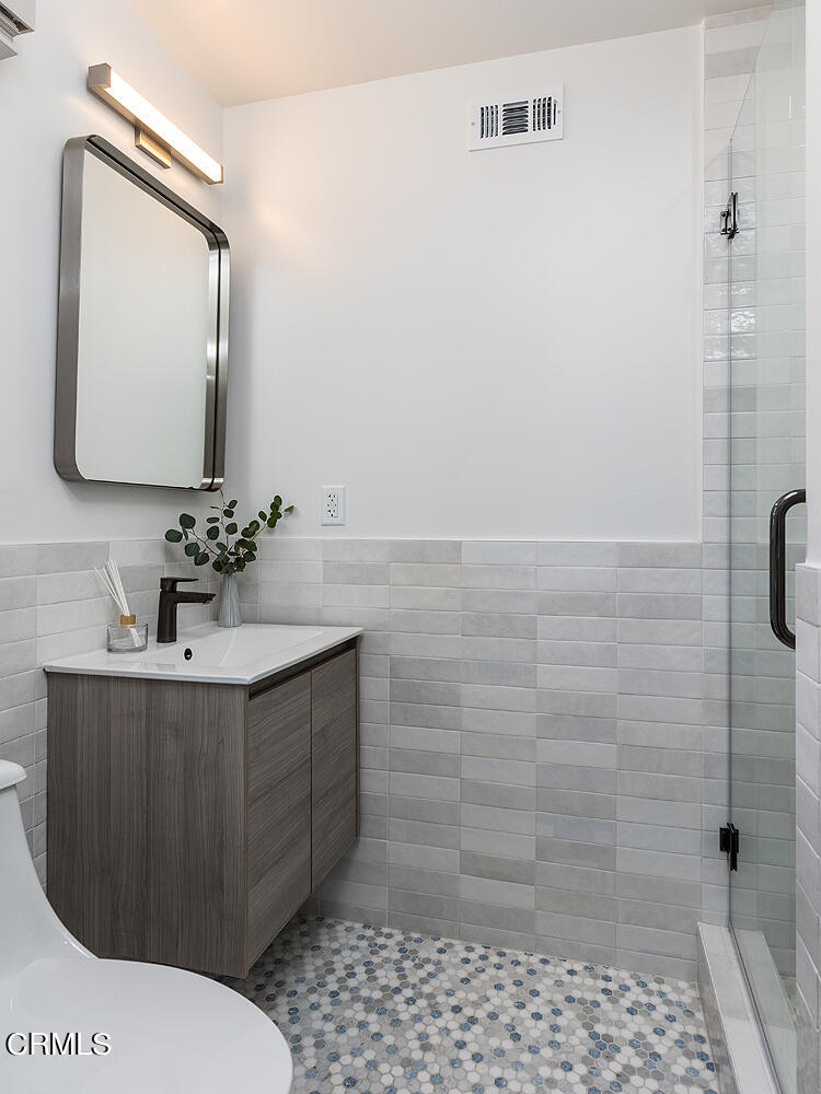 3142 Lincoln Avenue Altadena, CA 91001 - Photo 22 of 48 a bathroom with a sink vanity granite toilet and a mirror