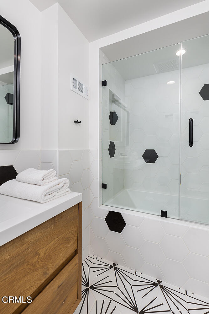 3142 Lincoln Avenue Altadena, CA 91001 - Photo 33 of 48 a bathroom with a granite countertop sink a toilet a mirror and shower