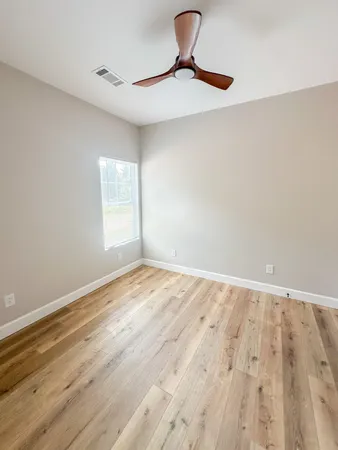 a view of an empty room and window