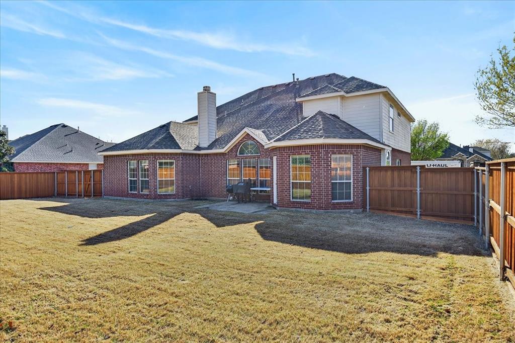 7308 Hawk Lane Sachse, TX 75048 - Photo 33 of 37 a front view of a house with a yard