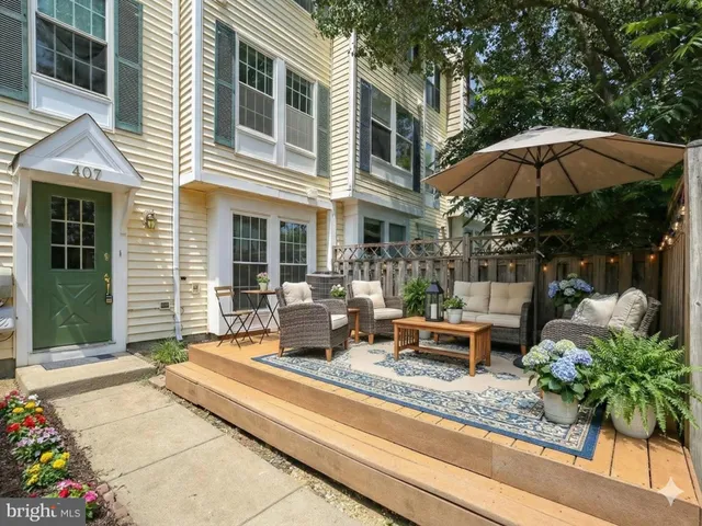 a view of a house with backyard sitting area and porch