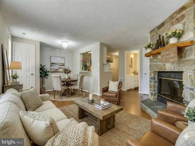 a view of a patio with table and chairs potted plants and wooden fence