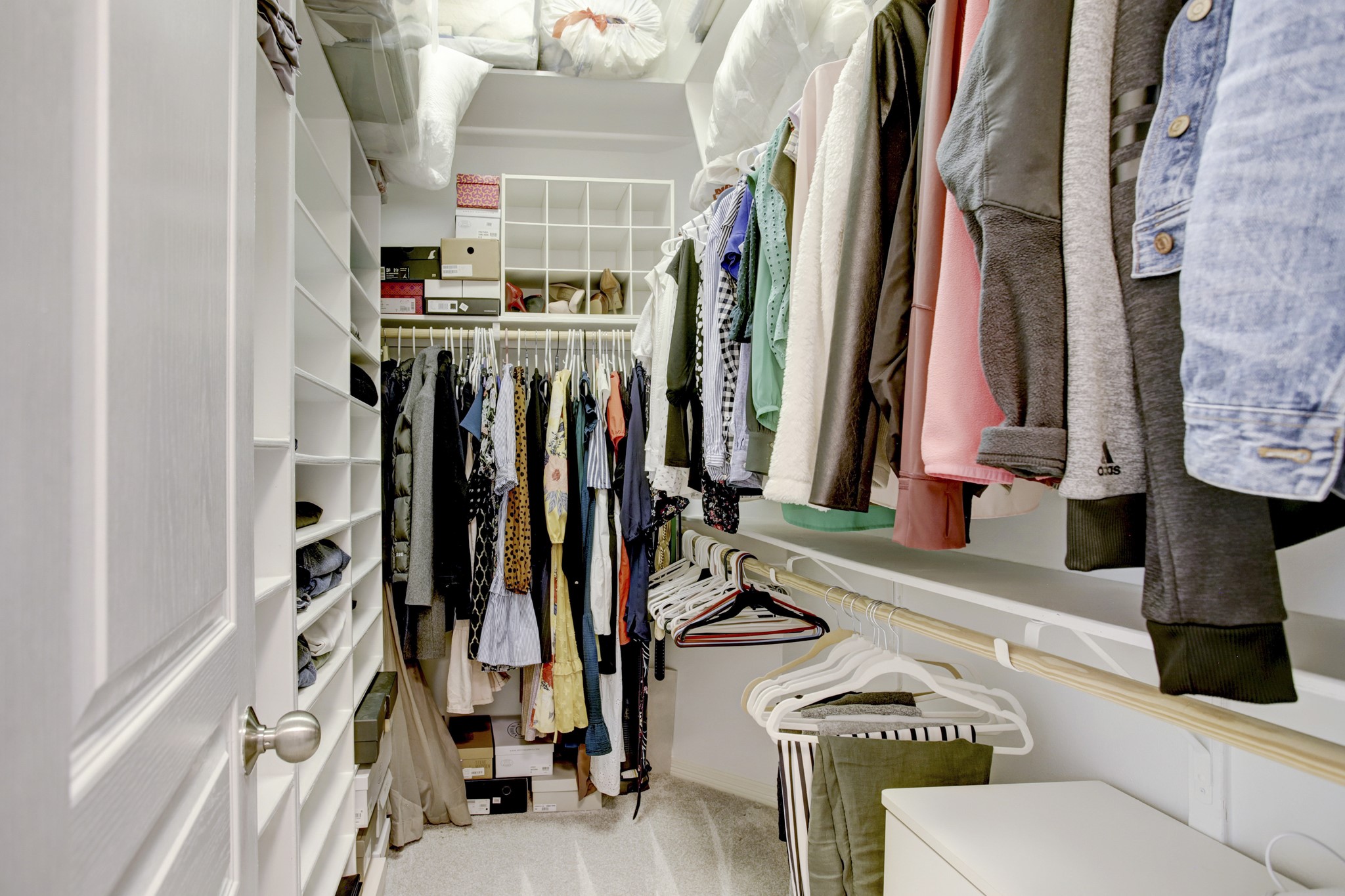 4230 Drake Street Houston, TX 77005 - Photo 20 of 38 Primary Suite Closet - The walk-in closet offers multiple drawers, double/single hanging rods, shoe racks and abundant shelves, providing many organizational choices.