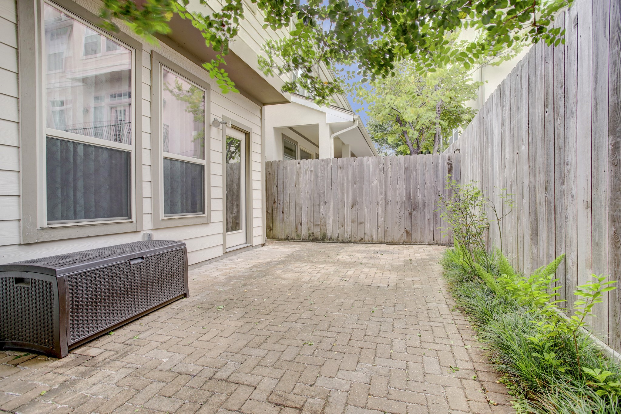 4230 Drake Street Houston, TX 77005 - Photo 27 of 38 Patio – What a rare find in an urban setting! Enjoy hosting cozy dinners or elegant soirées year-round in this patio. There is just enough space for kids to play or a pet to roam around.