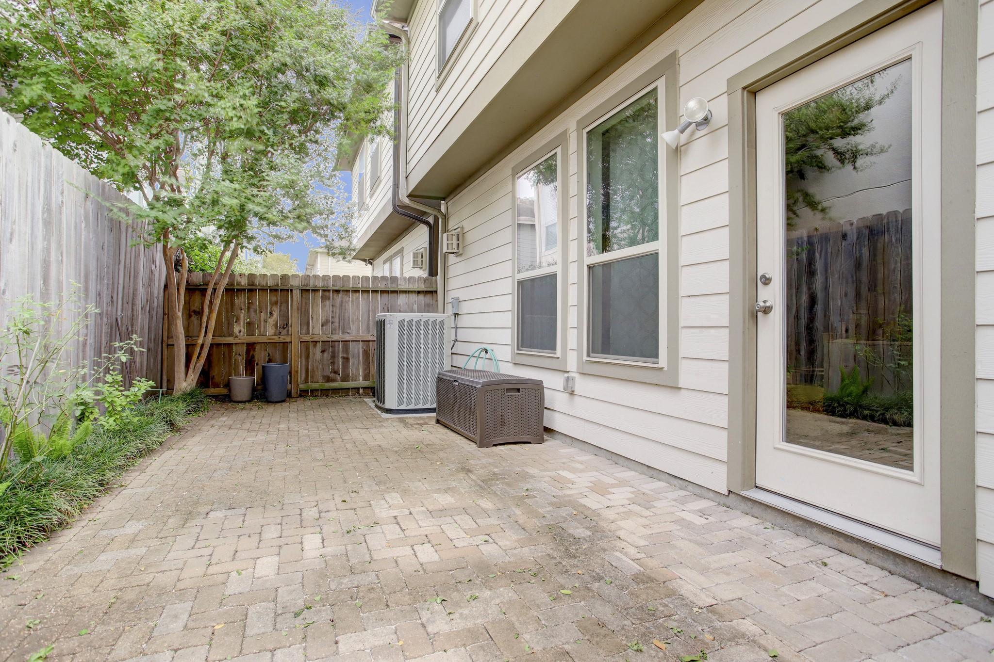 4230 Drake Street Houston, TX 77005 - Photo 28 of 38 Patio - The backyard is fully enclosed with a lockable privacy fence. The trees and high fence offer shade, privacy and beautiful views.