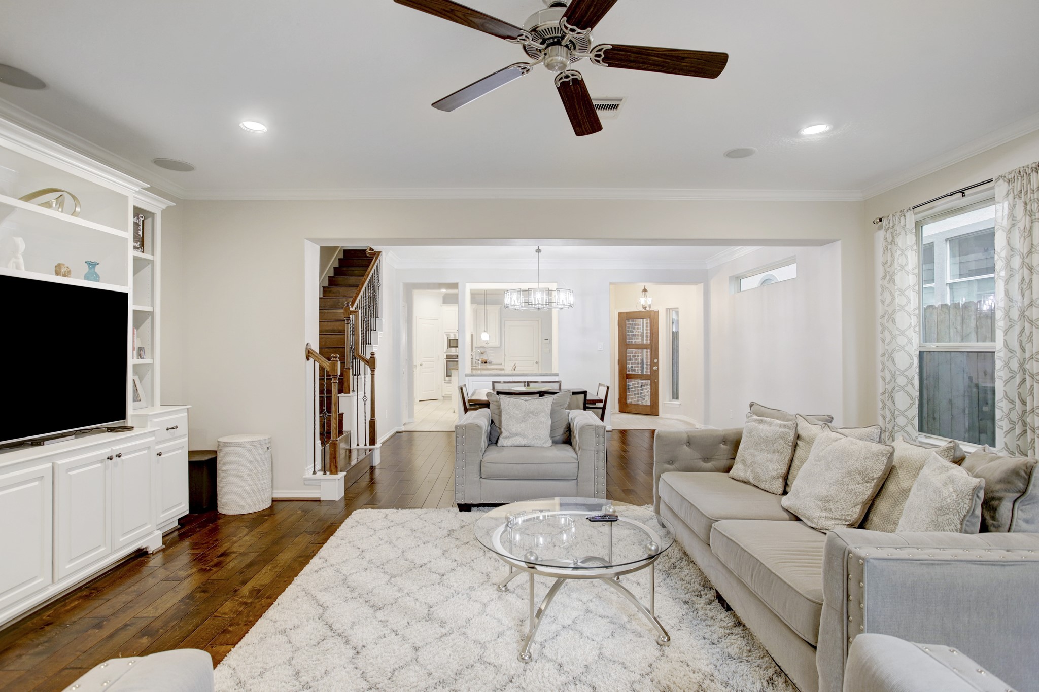 4230 Drake Street Houston, TX 77005 - Photo 37 of 38 1st Floor - What a rare find! All of the living spaces are conveniently located on the first floor and all bedrooms, an office, a workspace and a bonus room are located upstairs. The gathering spaces offer an open and efficient floor plan that is perfect for entertaining and everyday living.