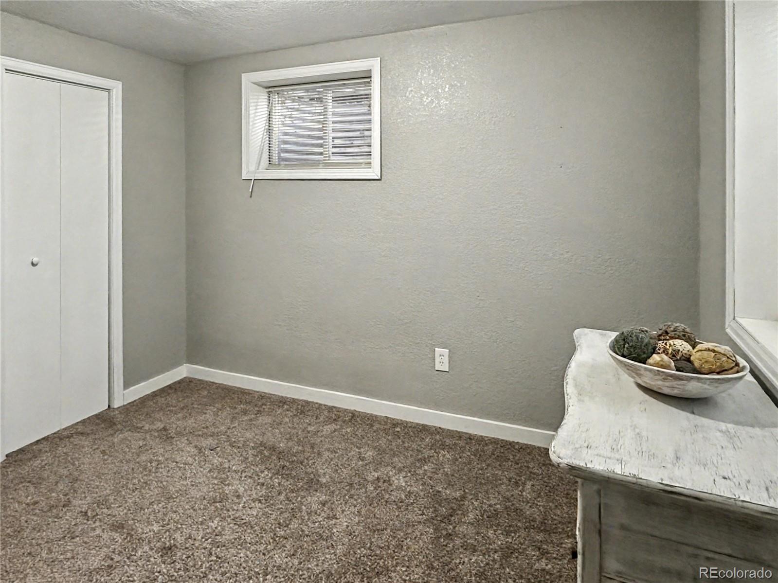 804 Nicole Road Sterling, CO 80751 - Photo 21 of 24 a room that has a table in it