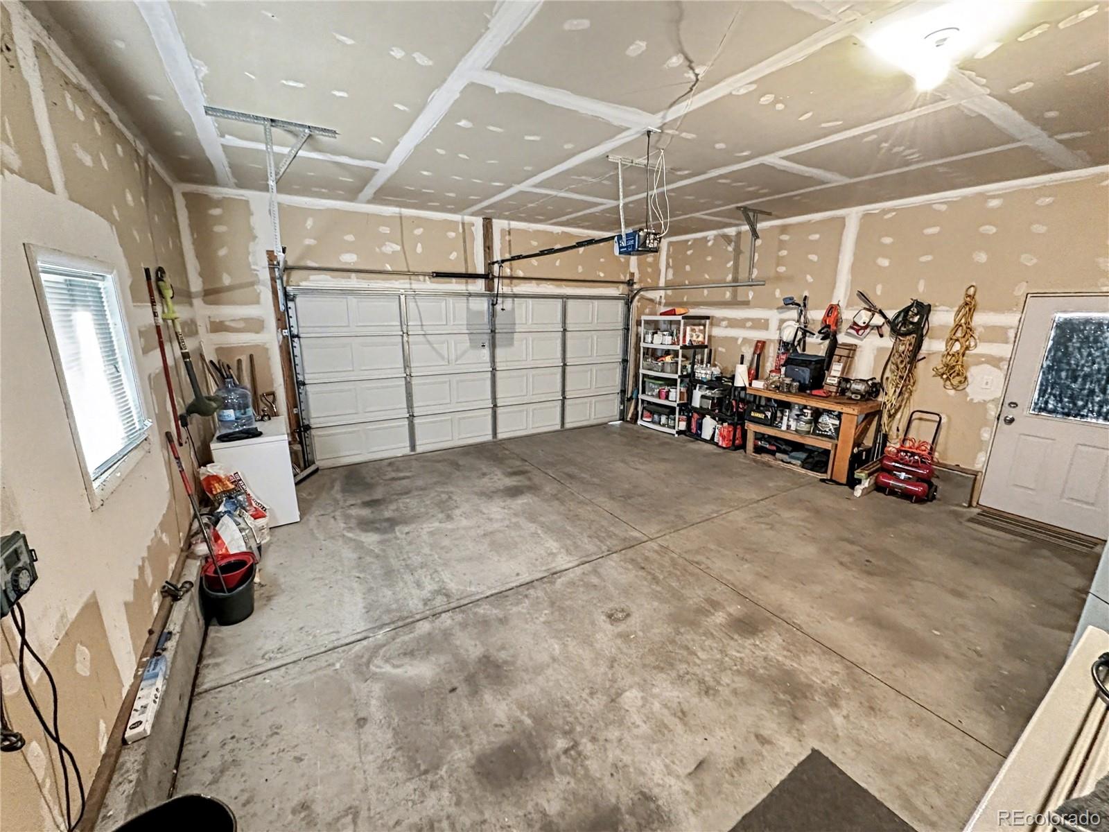 804 Nicole Road Sterling, CO 80751 - Photo 23 of 24 a view of a garage with rack and bicycle